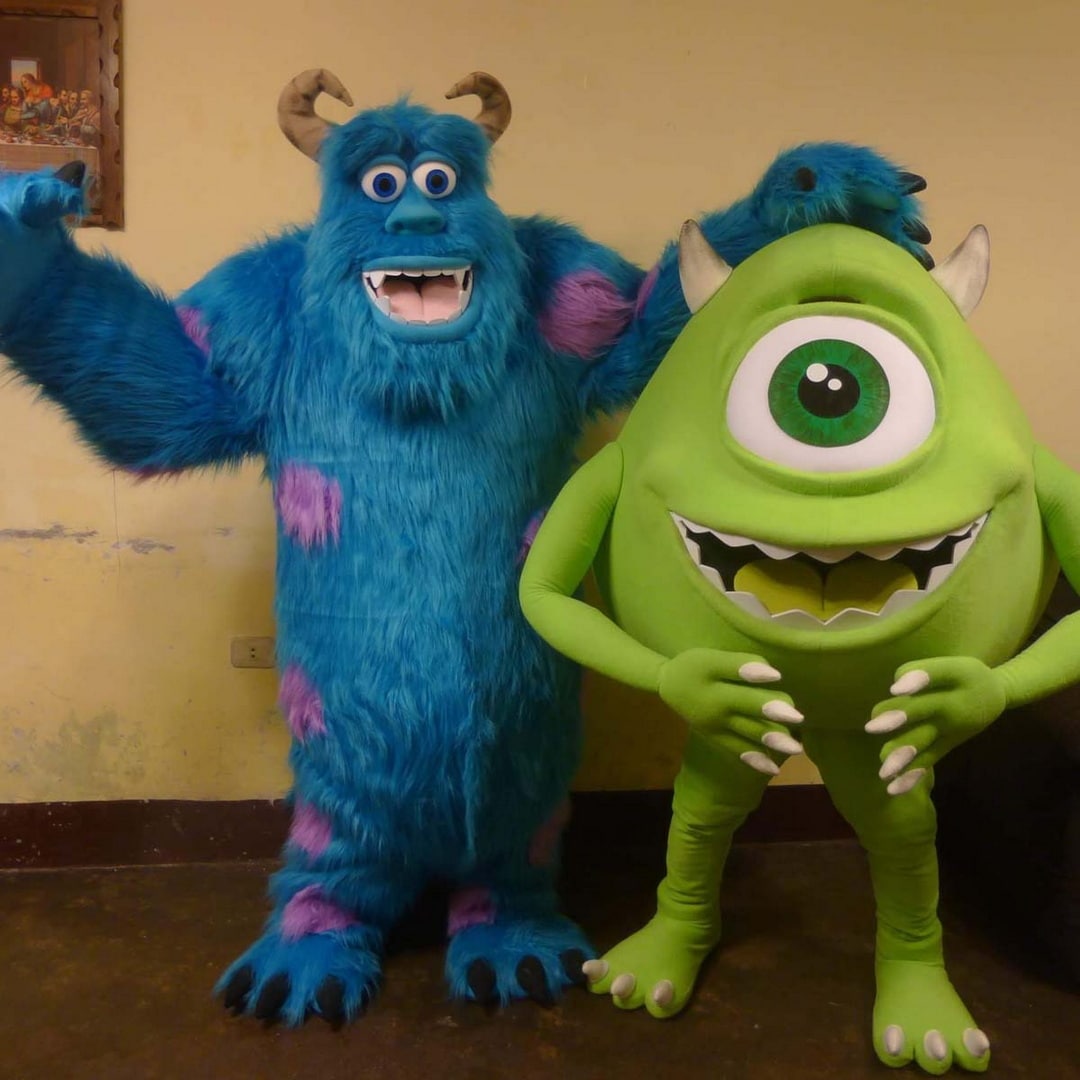 party character green and blue monster mike and sully disney