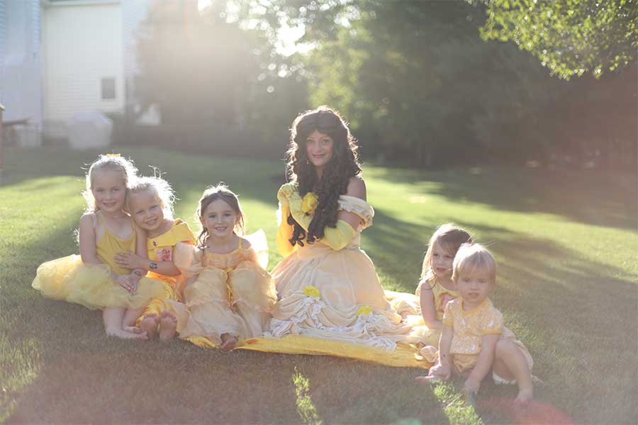 Stardust Entertainment Character Rose Princess Belle sitting with children